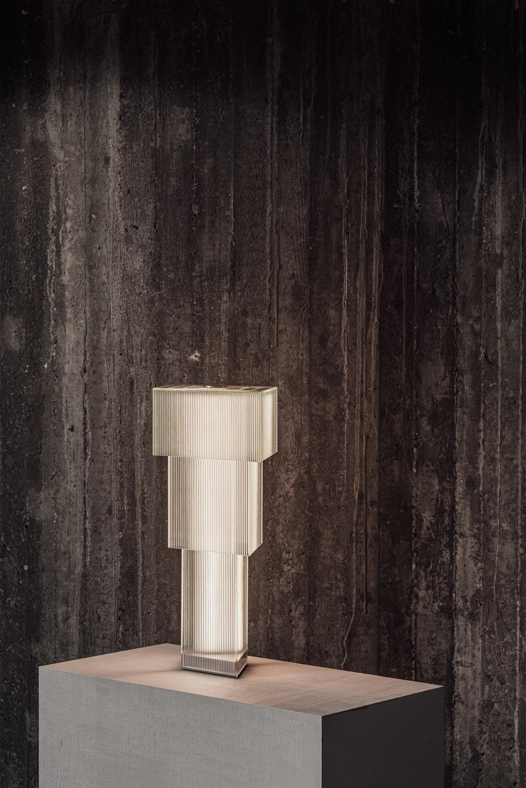 Detail of the Shroud table lamp - three layers of ribbed glass by Wouter Lievens, each angle revealing a different pattern